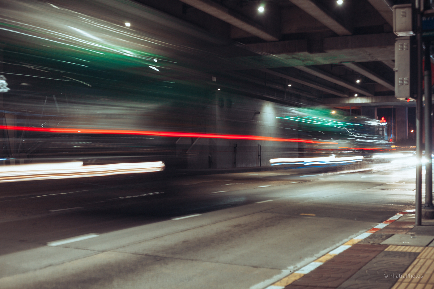 Long exposure of a bus under an overpass
