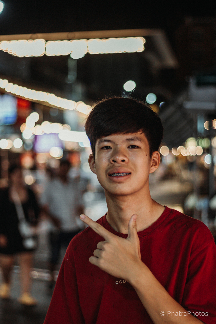Portrait with street lights glowing behind